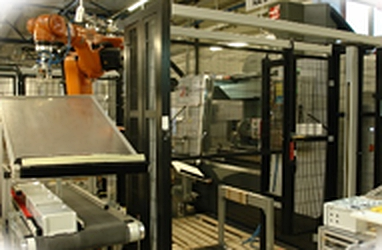 Robot cell automating machine handling